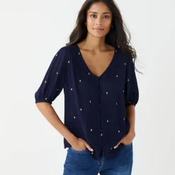 Bloes in crepon met goudkleurige print