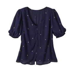 Bloes in crepon met goudkleurige print