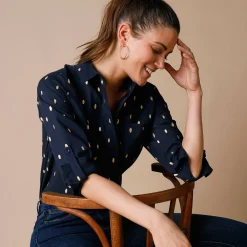 Bloes met goudkleurige print