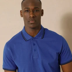 Effen polo in piquétricot met korte mouwen