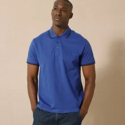 Effen polo in piquétricot met korte mouwen