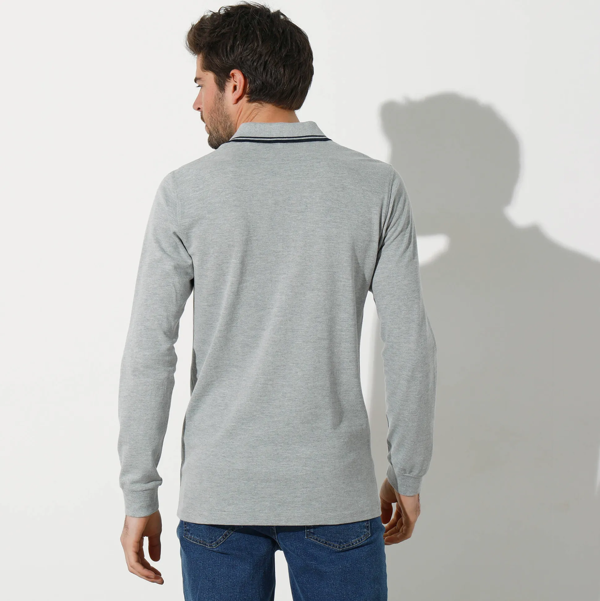Effen polo in piquétricot met lange mouwen
