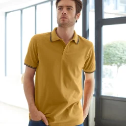 Effen polo in piquétricot met korte mouwen