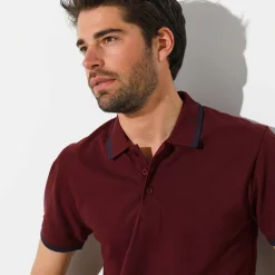 Effen polo in piquétricot met korte mouwen