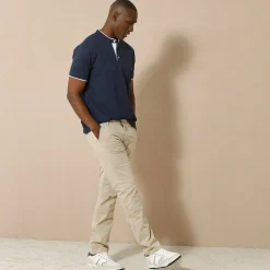 Effen polo in piquétricot, met maokraagje en korte mouwen