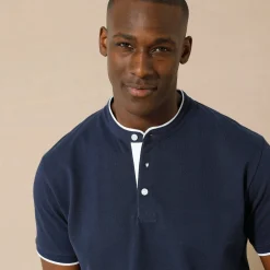 Effen polo in piquétricot, met maokraagje en korte mouwen