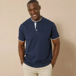 Effen polo in piquétricot, met maokraagje en korte mouwen
