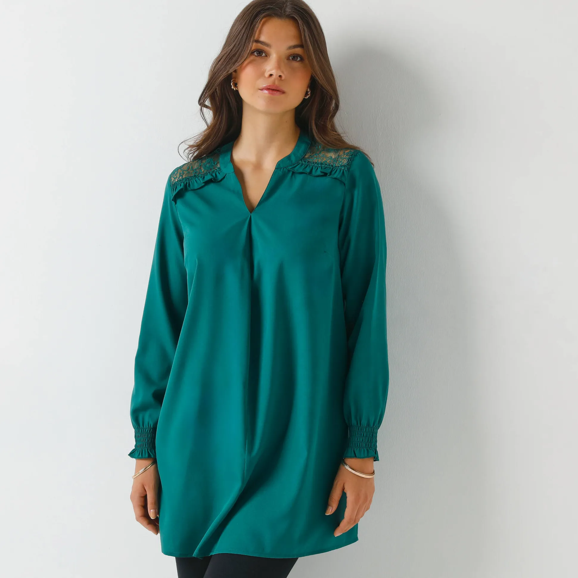 Effen tuniek met kant en lange mouwen