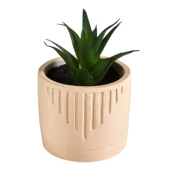 Groene kunstplant en pot in cement