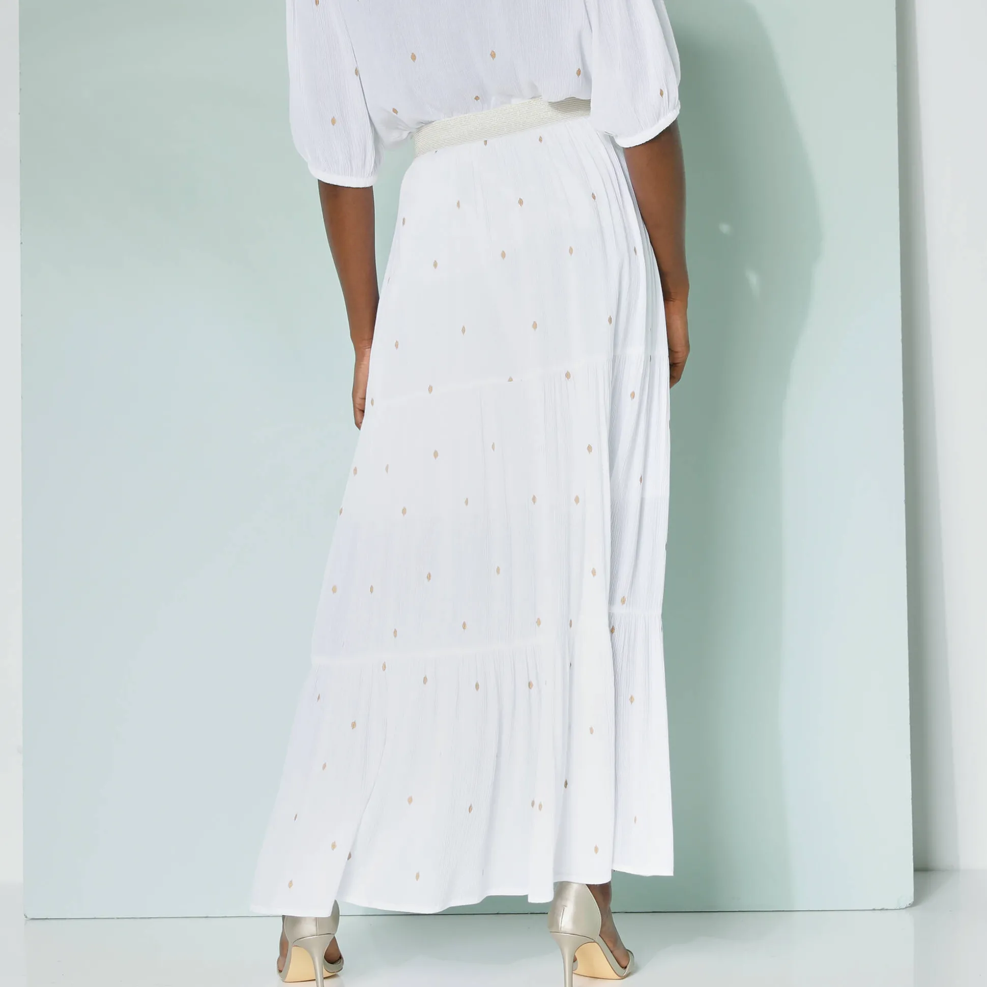 Lange fronsrok met goudkleurige prints