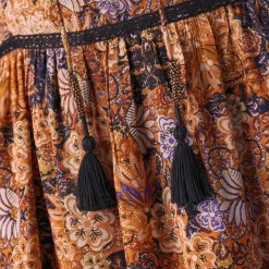 Lange jurk met bloemenprint en afwerkingen in macramé