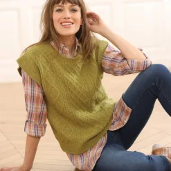 Mouwloze trui met kabelmotieven en afhangende schouders
