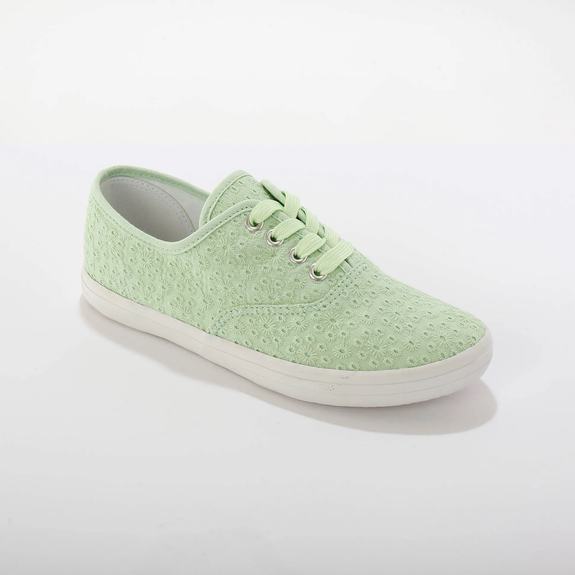 Sneakers in geborduurd canvas