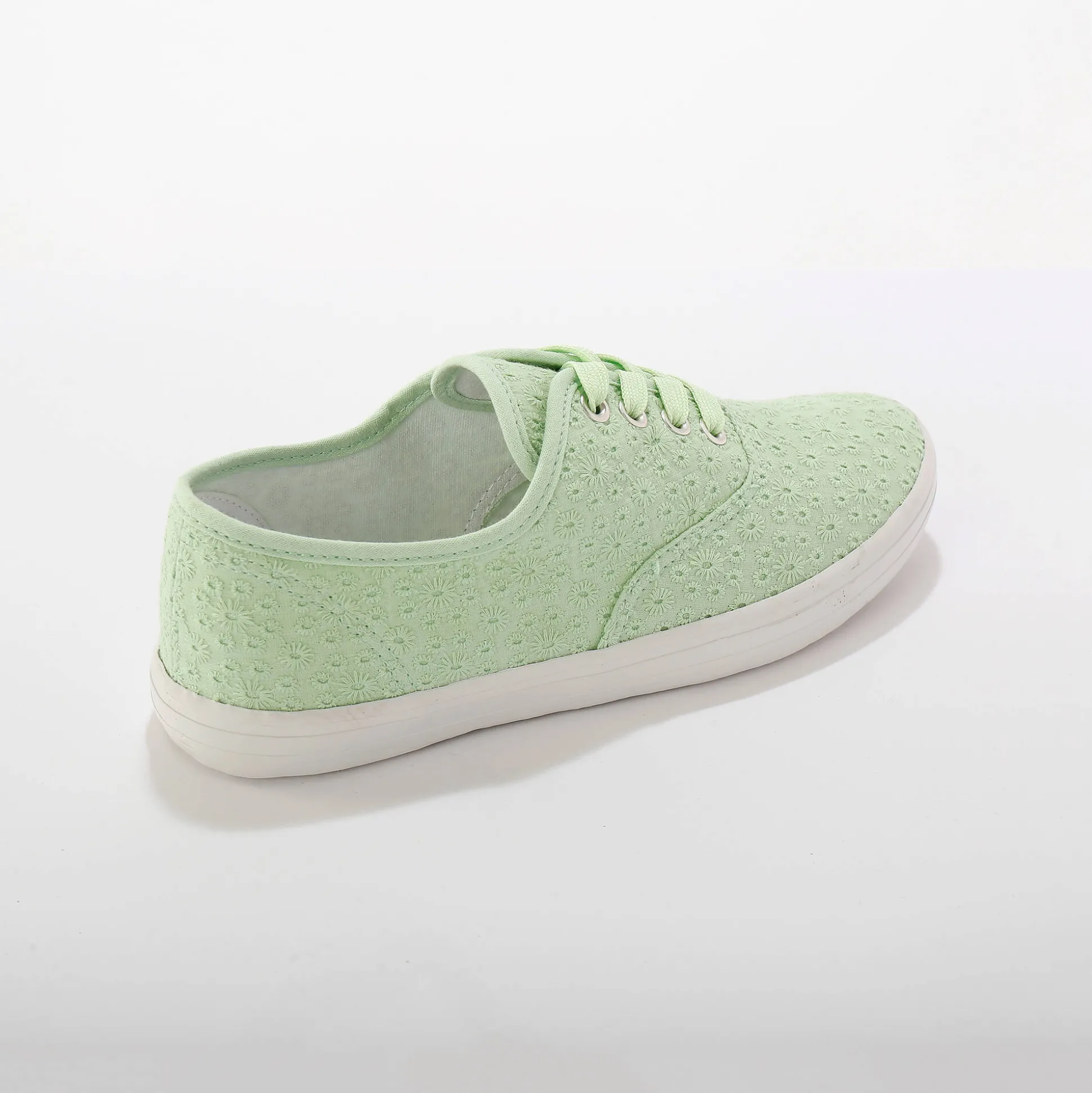 Sneakers in geborduurd canvas