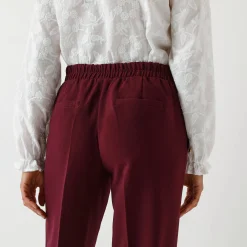 Soepele broek met knooppandeffect