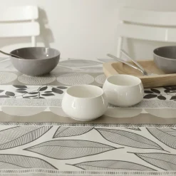Tafellaken in toile cirée met bladeren- en tafellopereffect
