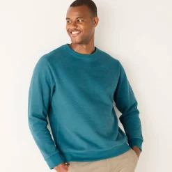 Warme sweater met ronde hals, borduursel op de borst, in ribtricot